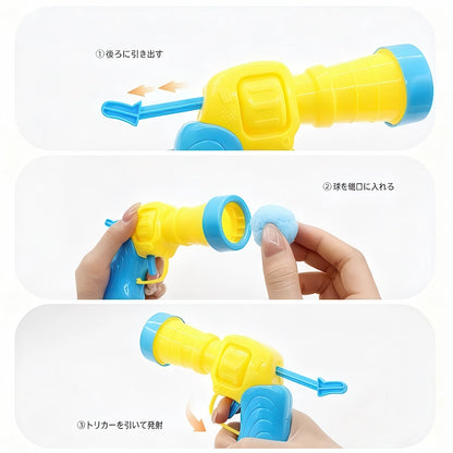 猫用ボールランチャーの簡単な使い方の3ステップ解説。後ろにレバーを引き出し、銃口に毛玉を入れ、トリガーを引いて発射するだけ。誰でも簡単に猫の運動不足解消が可能です。